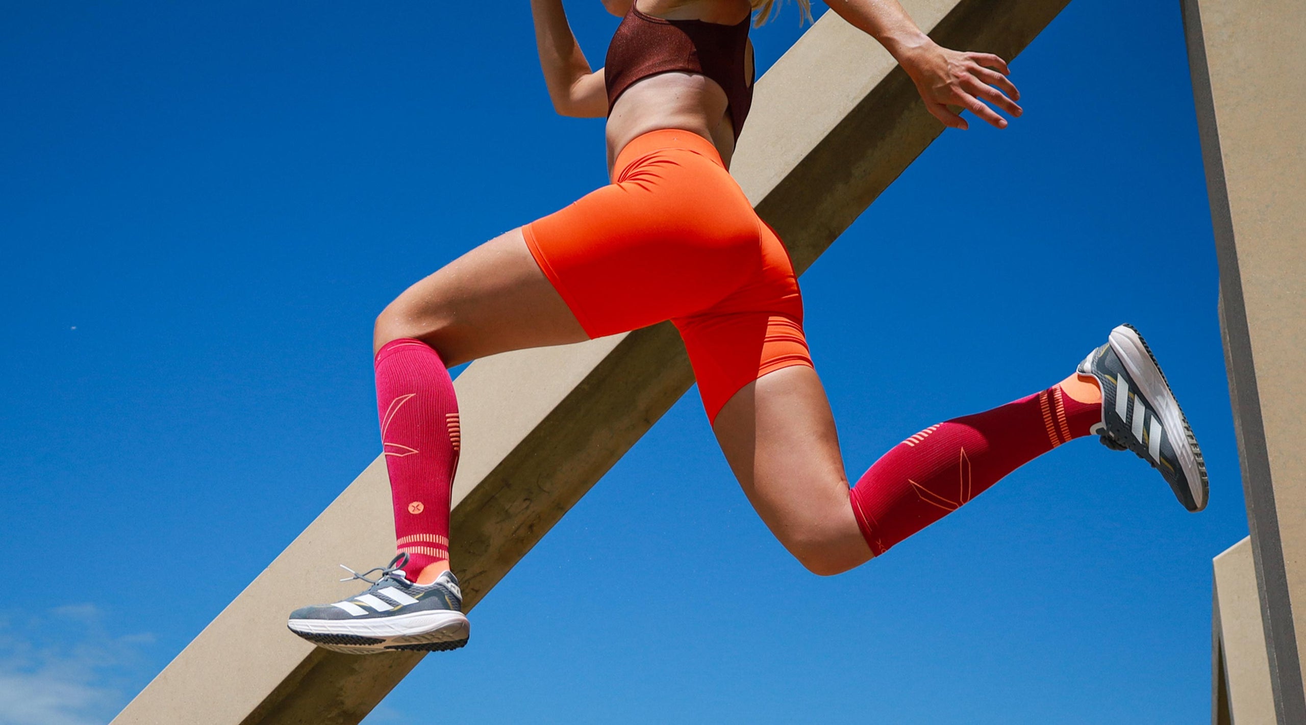 Jumping woman with blue sky