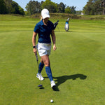 Romy Meekers walking with a white cap on.