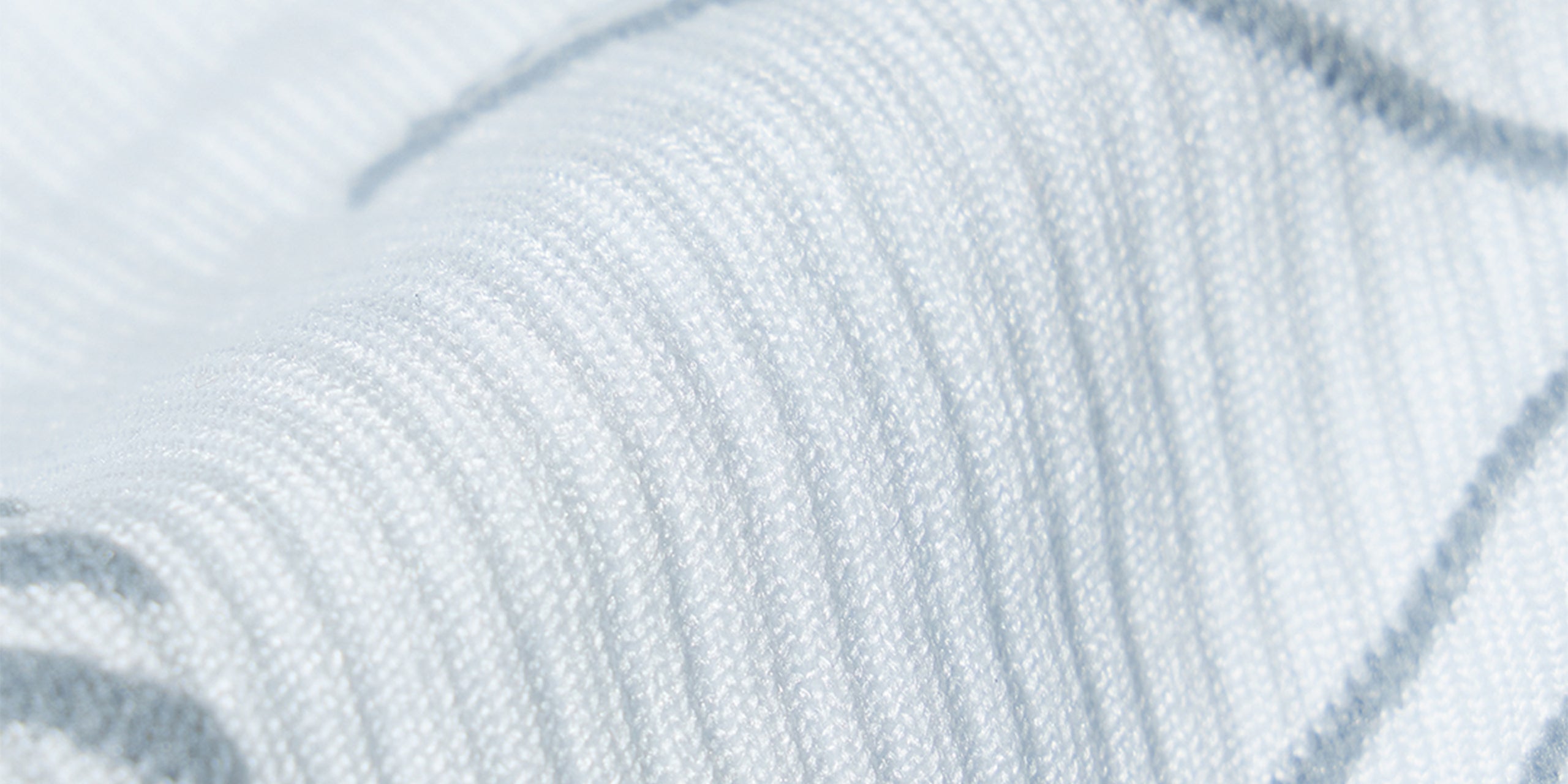 White fabric with grey details.