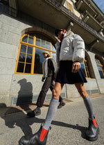 Two people walking. -