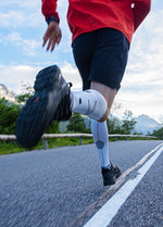 People running in yellow and black clothing. -
