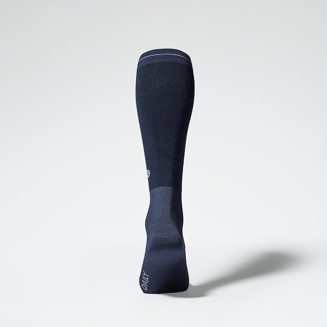 Back view of a navy compression sock.