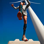 Person jumping in the air with his legs spread wide.