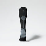 Back view of black knee high sock with grey accents.