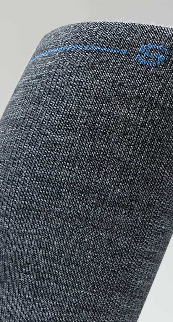 Close-up of a dark grey sock featuring a blue logo and design detail.
