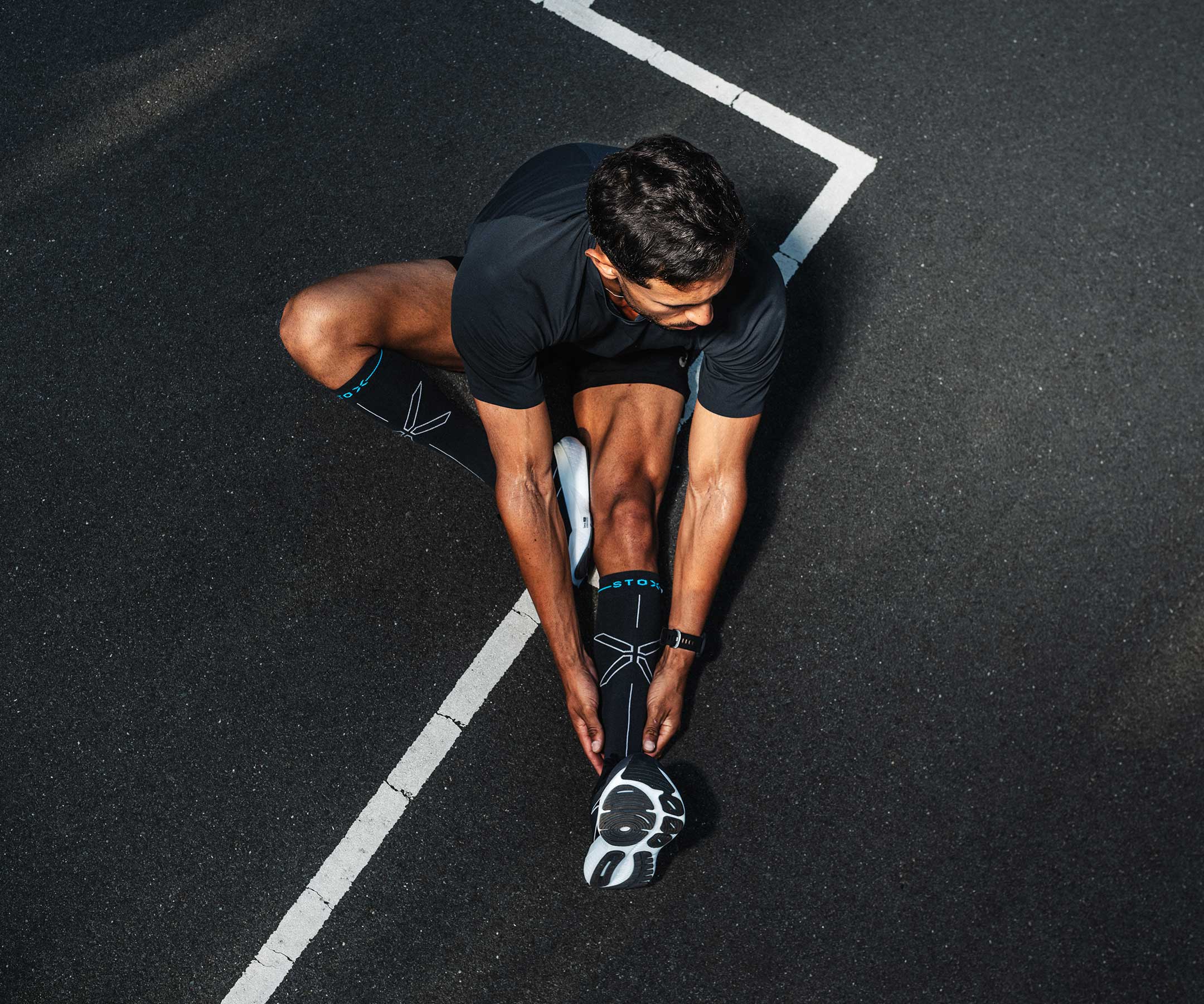Person stretching on a black socks