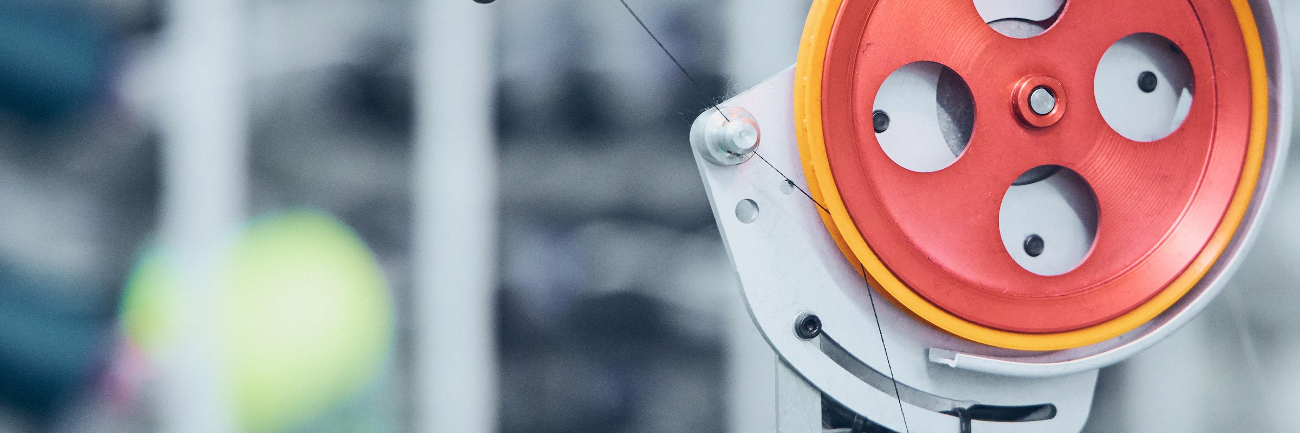 Red spinning wheel with orange ring around it.