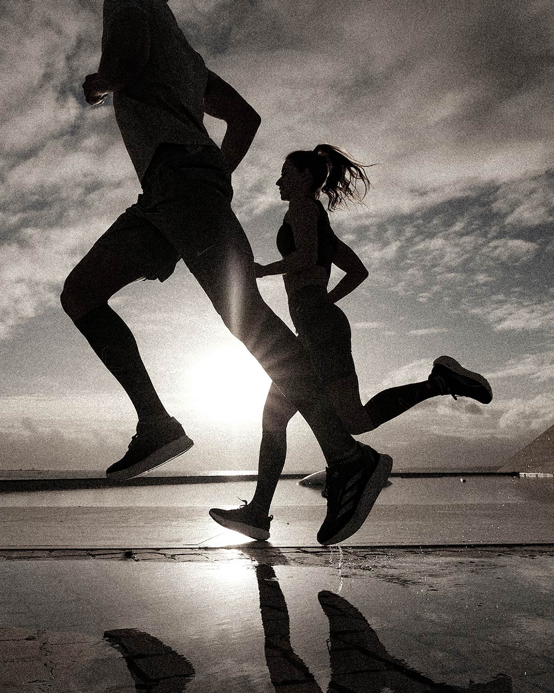 Duo running in the dunes with compression socks.