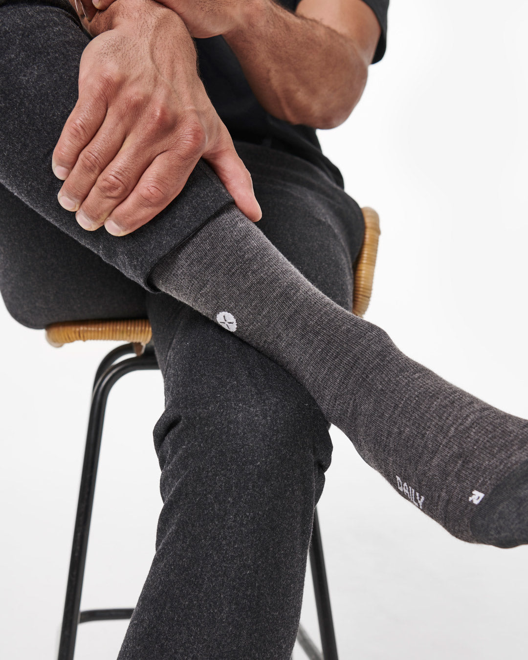 Sitting man with compression socks.