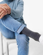 Sitting men with compression socks.