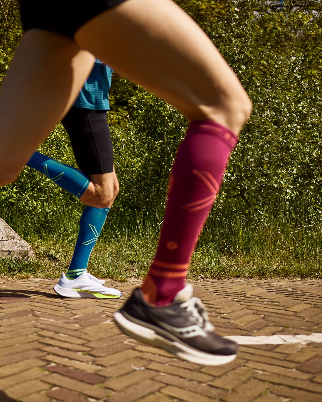 Duo running with compression socks.