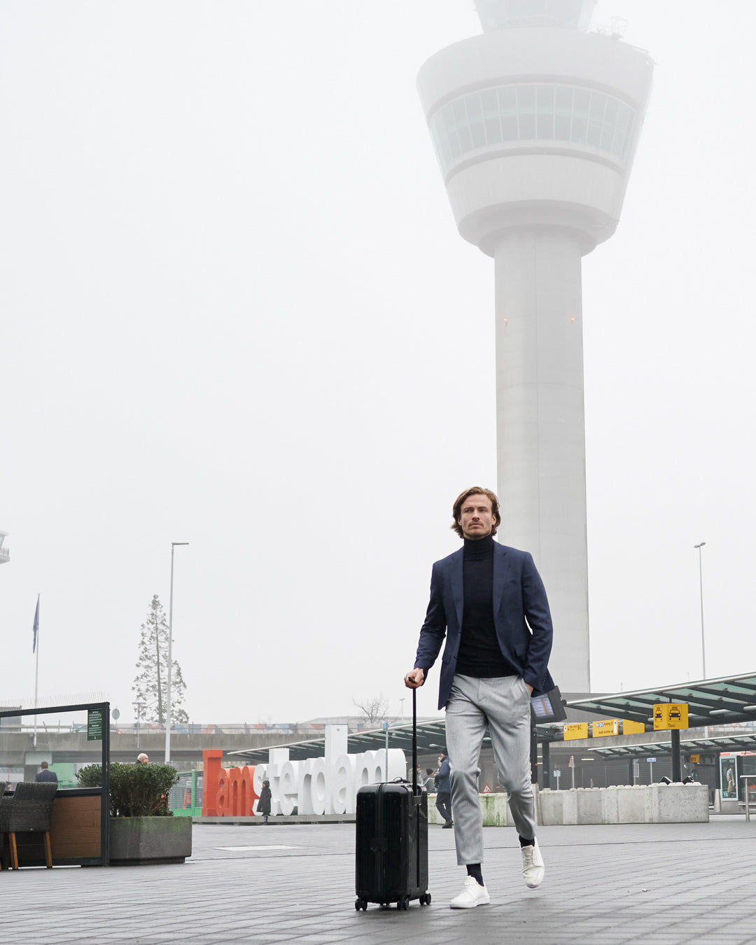 Men walking on the airport with compression socks.