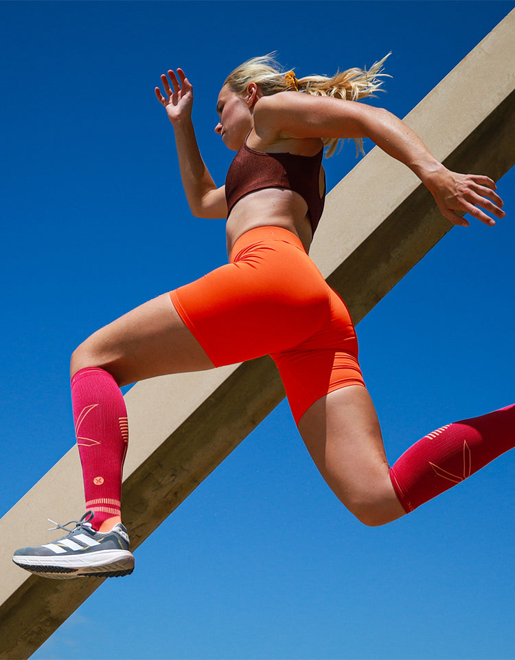 Jumping woman with blue sky