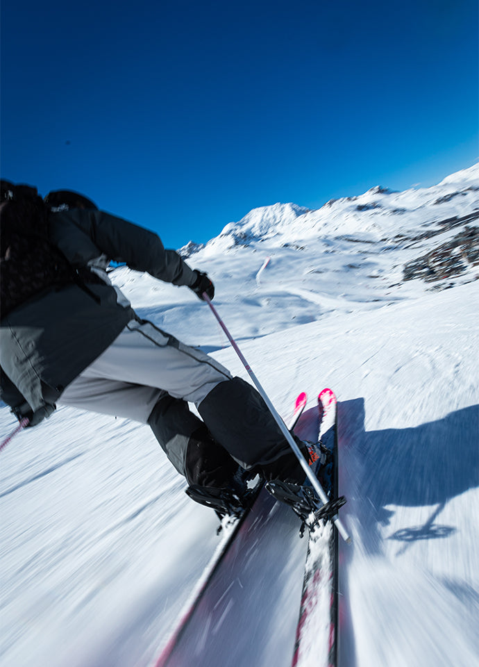 Skier descending a slope.