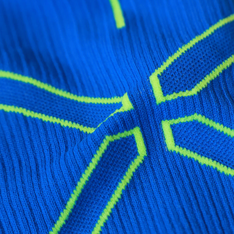 Zoomed in detailed shot of blue moisture wicking fabric. 
