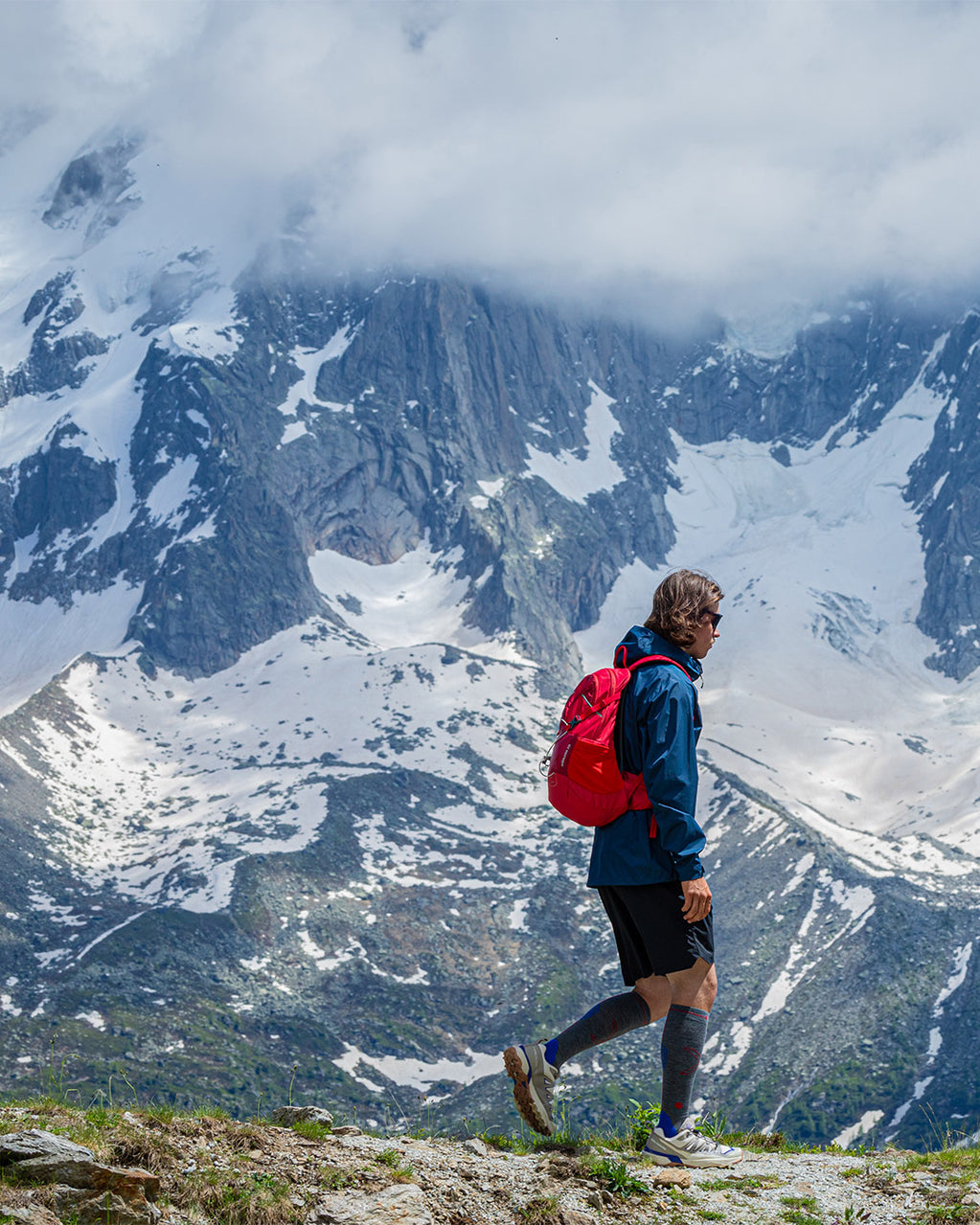 Man walking over rocks.