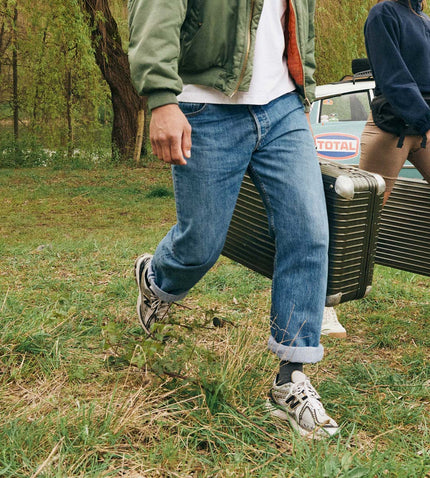 Men walking with a suitcase.