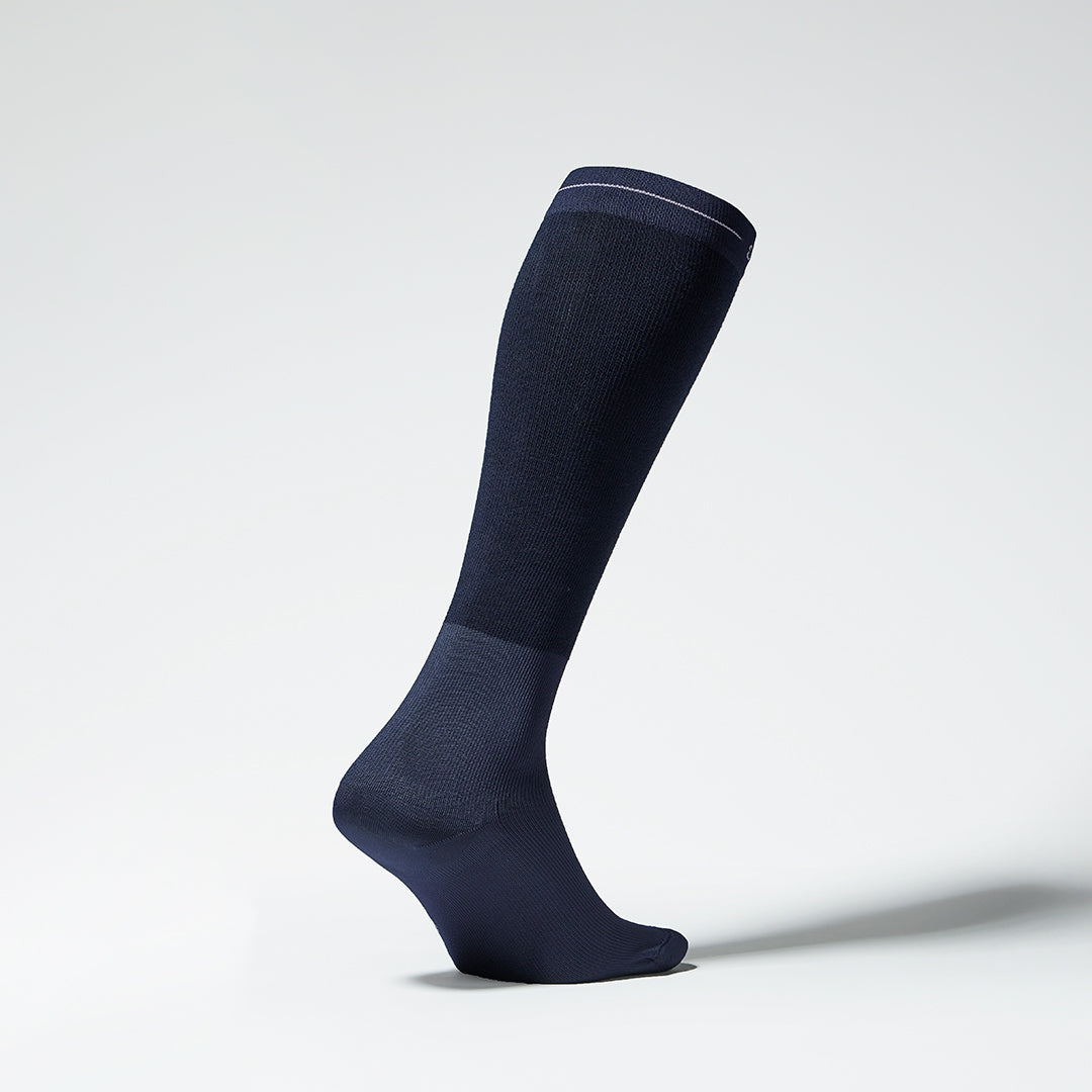 Side view of a navy compression sock.