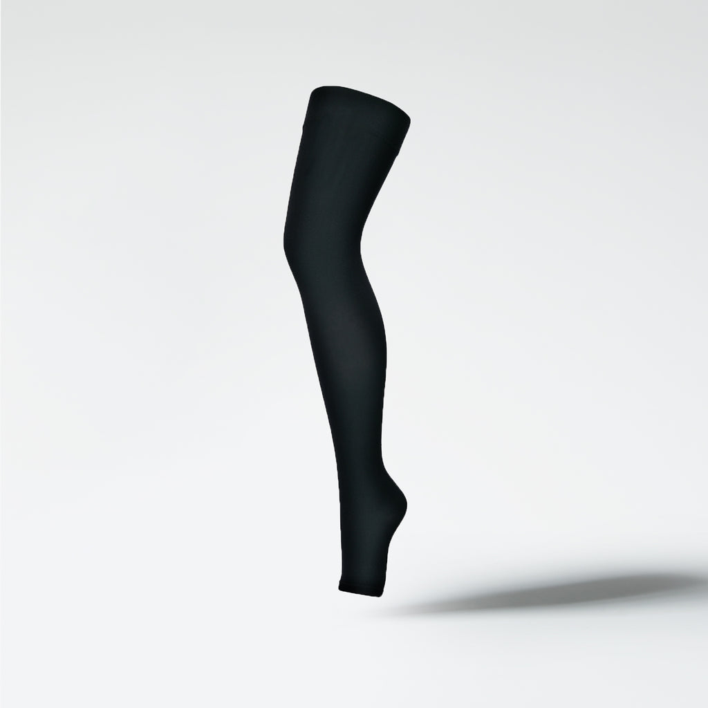 Front view of a medical thigh high stocking in black.