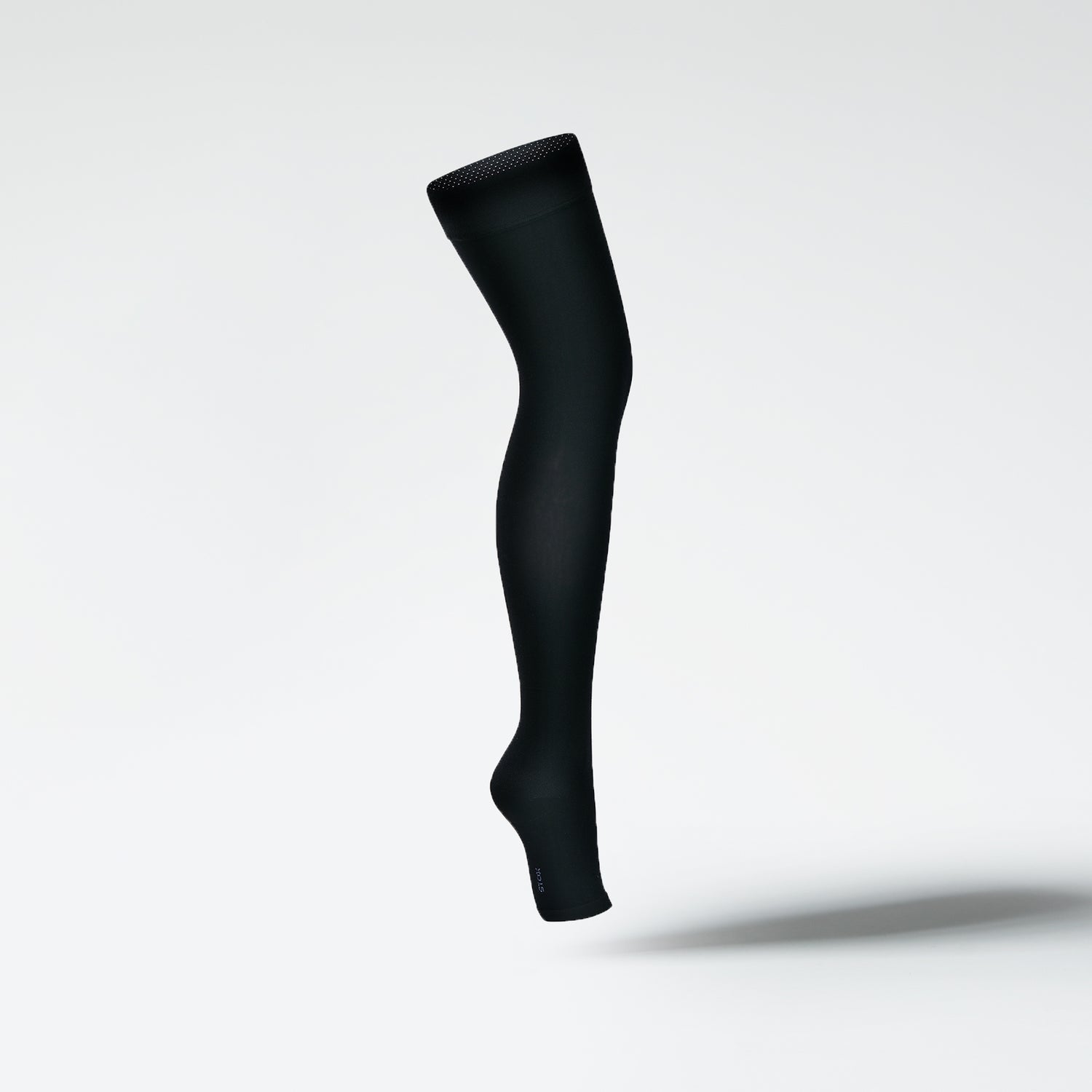 Side view of a medical thigh high stocking in black.