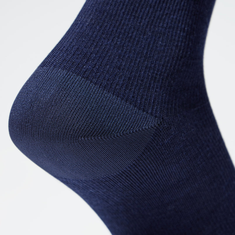 Detailed view of a blue compression sock.