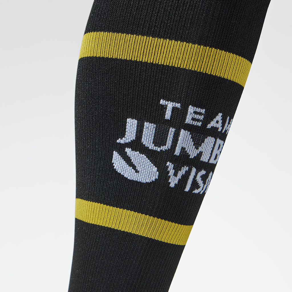 Detailed view of a black compression sock with team jumbo-visma logo.