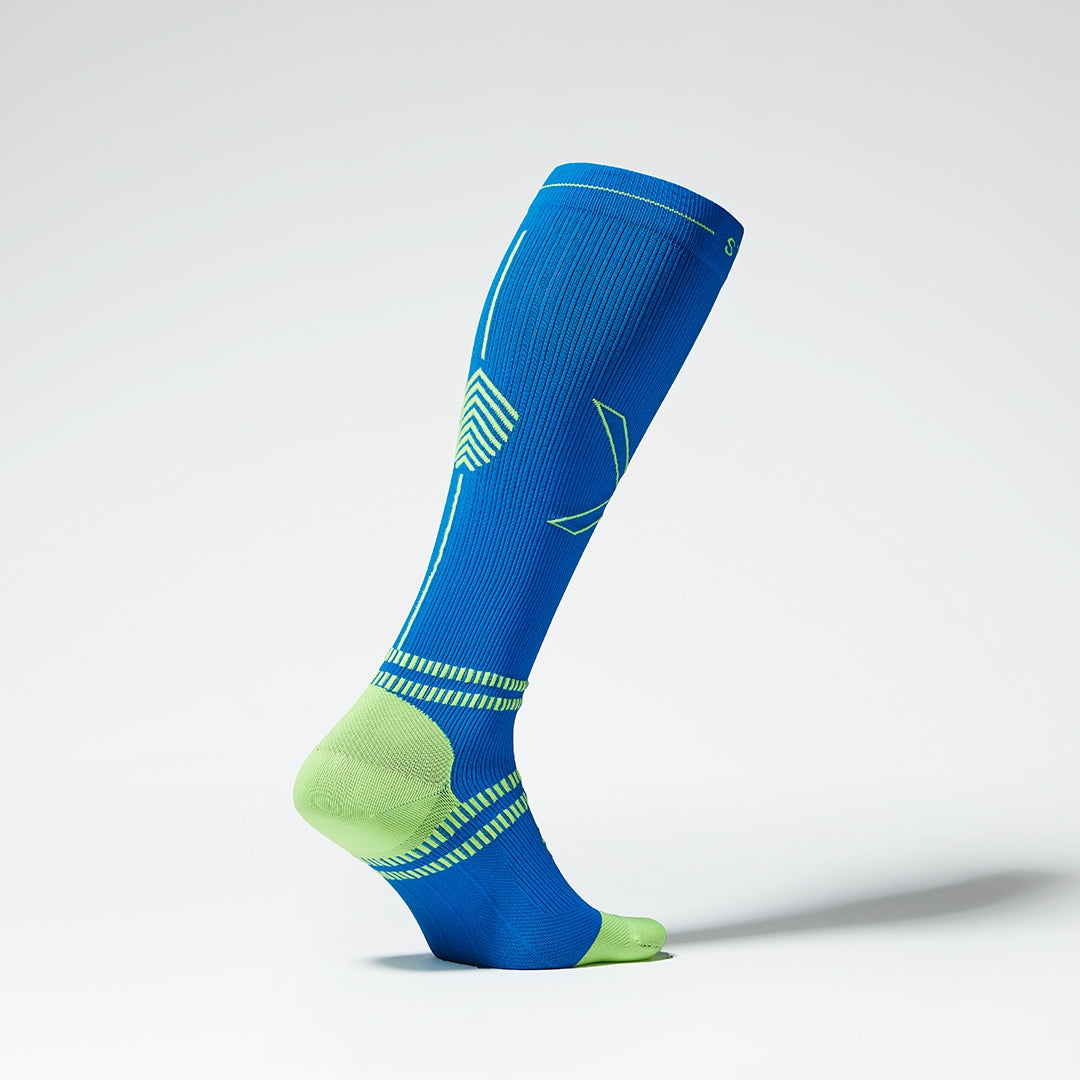 The side of a blue compression sock with yellow details.