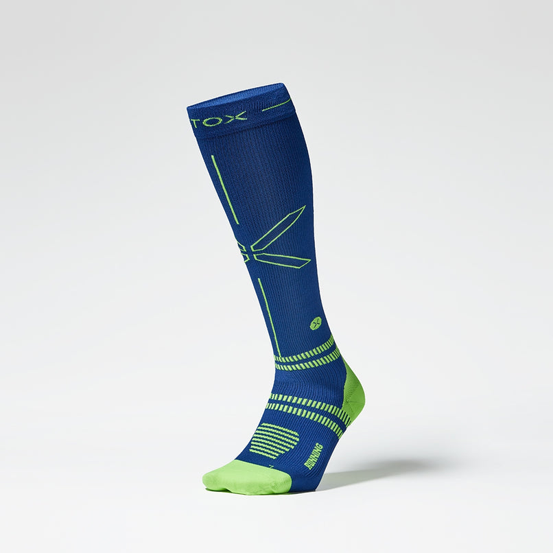 The front of a standing dark blue sock with yellow accents.