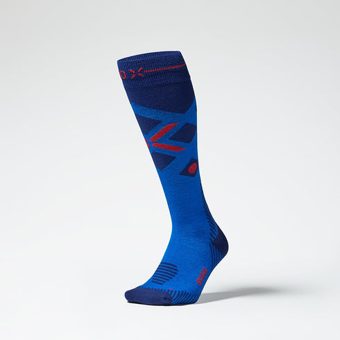 Front view of blue compression socks with red details.