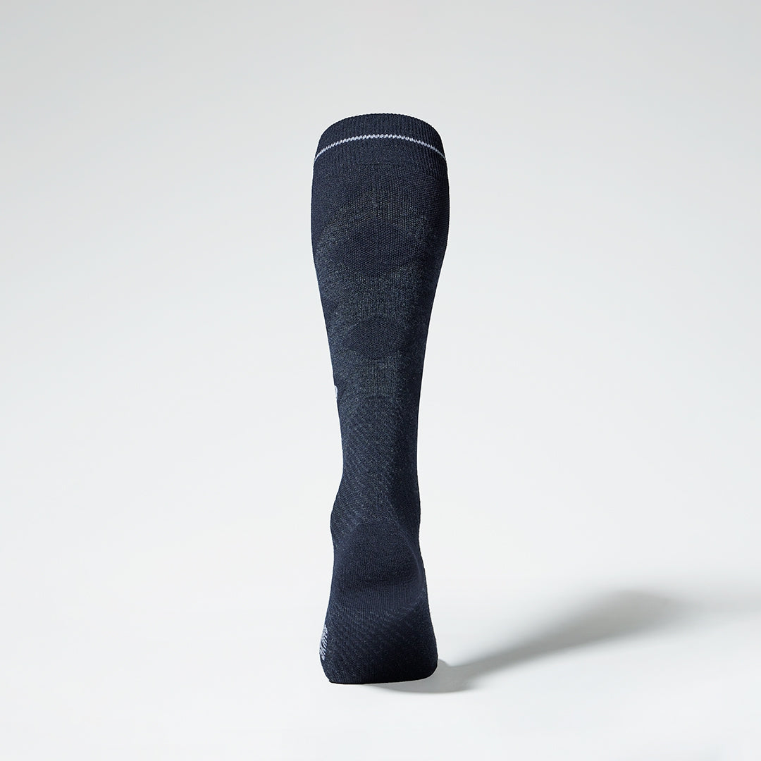 Back view of dark navy compression socks with white details.