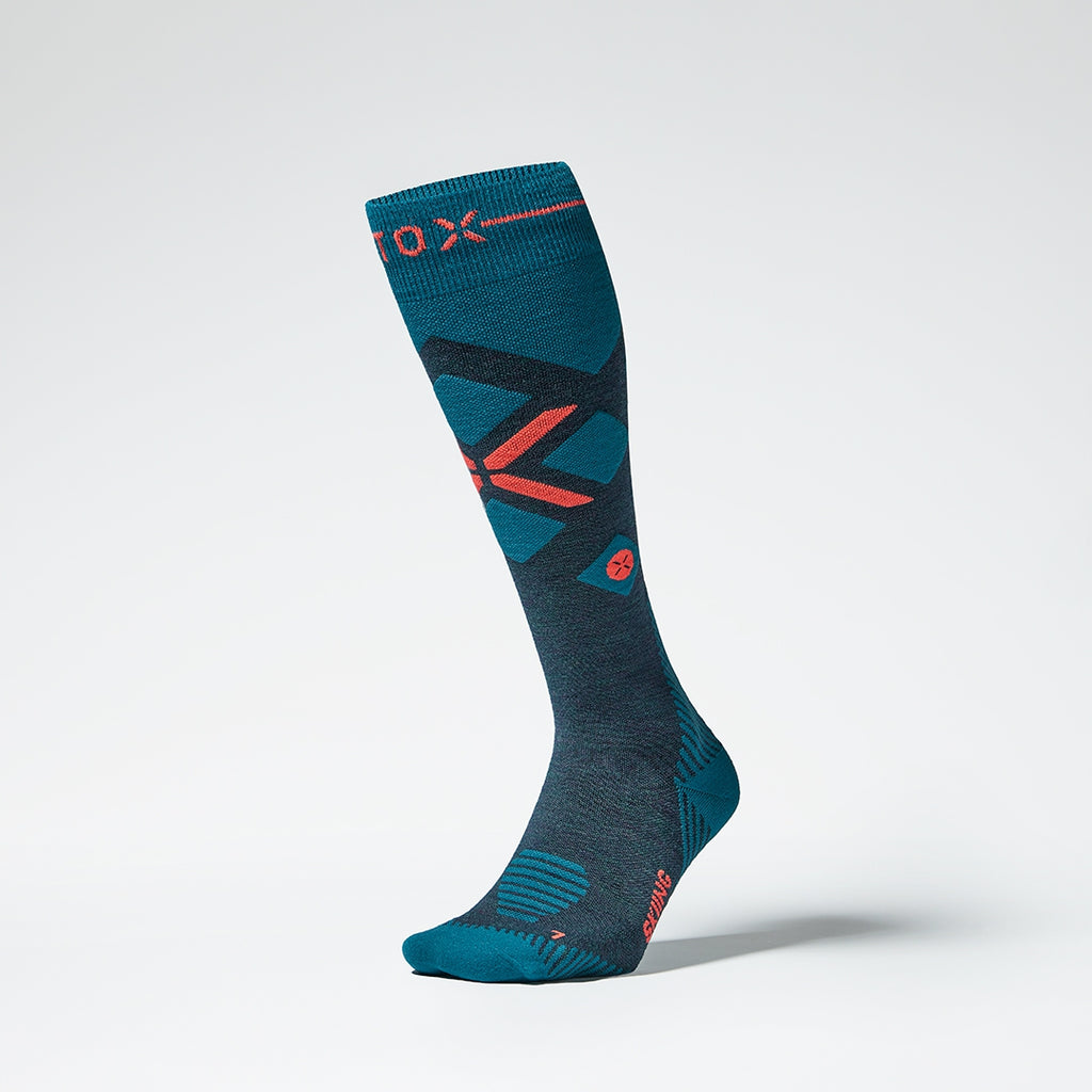 Front view of dark green compression socks with orange details.