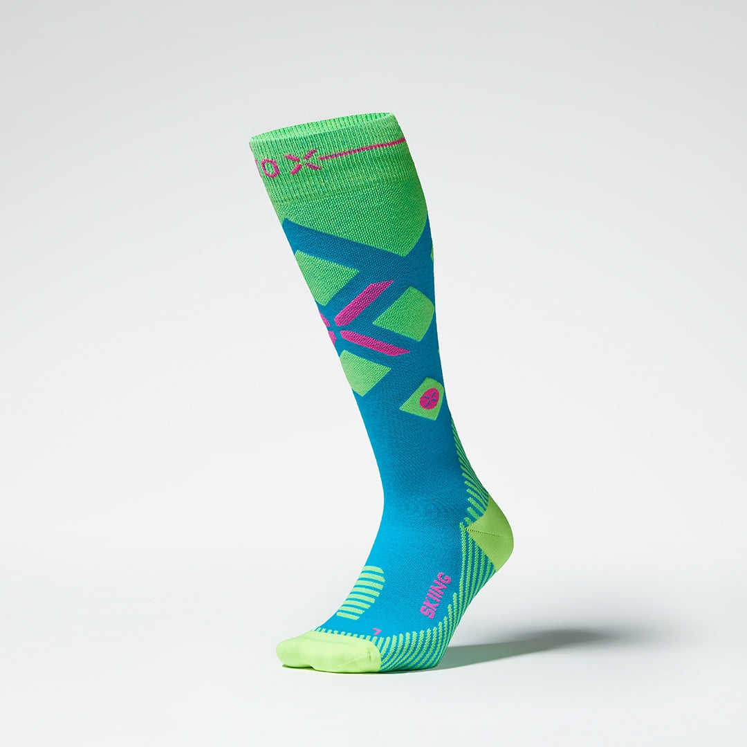 Front view of blue and yellow compression socks with pink details.