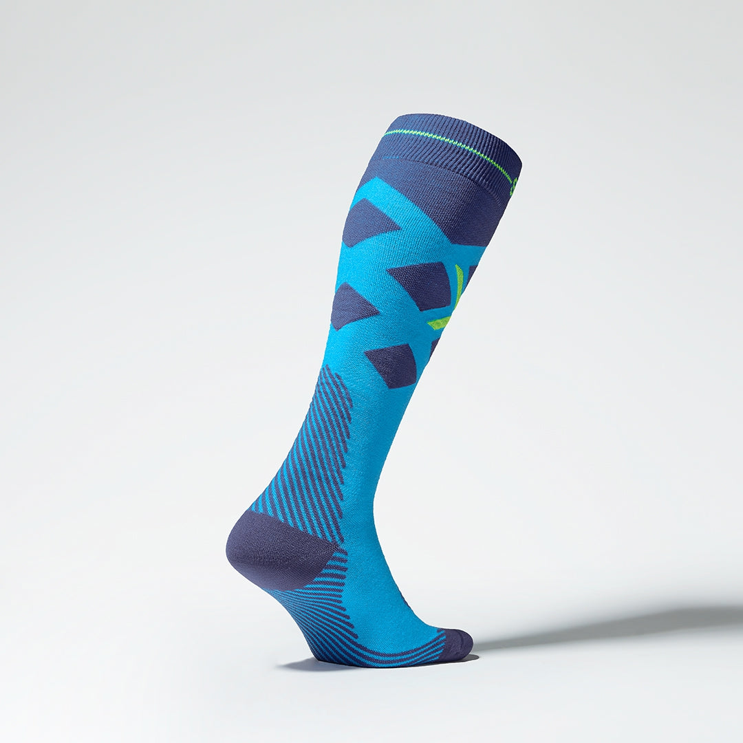 Side view of turquoise compression socks with yellow details.