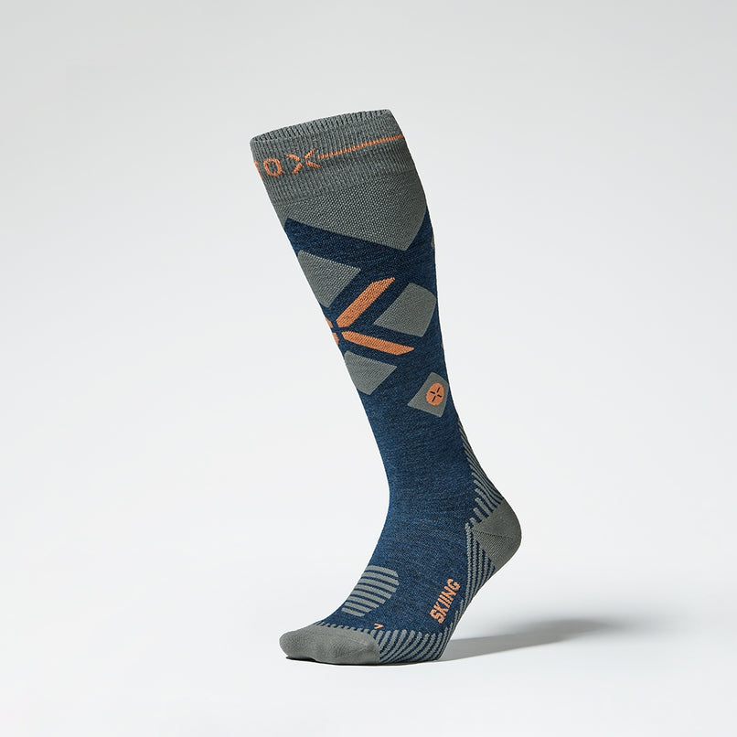 Front view of a blue grey compression skiing socks with orange details.