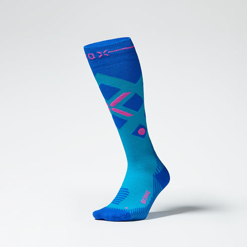 Front view of a turquoise compression skiing socks with pink details.