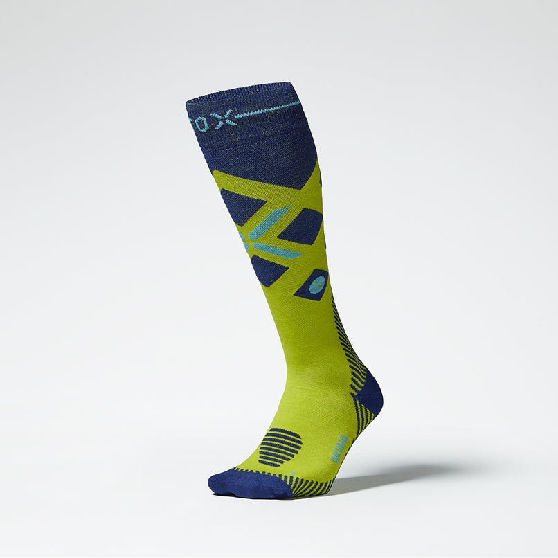 Front view of yellow compression socks with bright blue details.