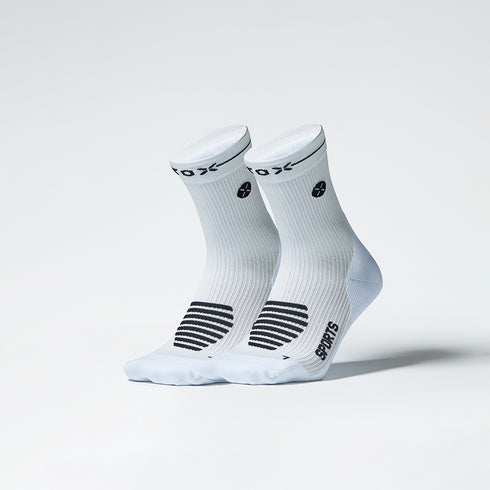 Two white ankle socks with black details. 