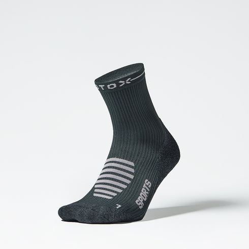 Front view of a dark grey ankle high compression sock. 