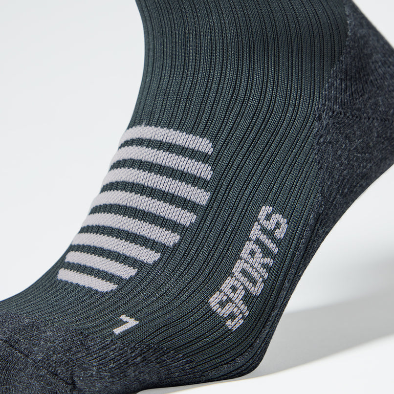 Grey compression sock with light grey details. 