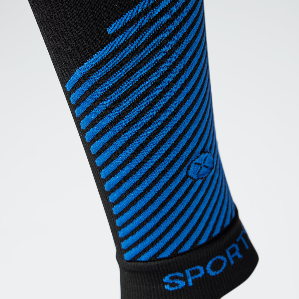 Detailed view of a black compression calf sleeve with blue details.