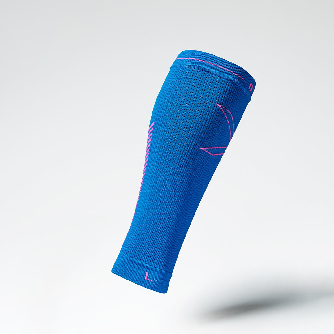 Side view of a blue compression calf sleeve with pink details. 