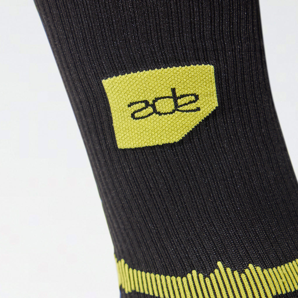 Close up of Amsterdam Dance Event logo on a black sock. 