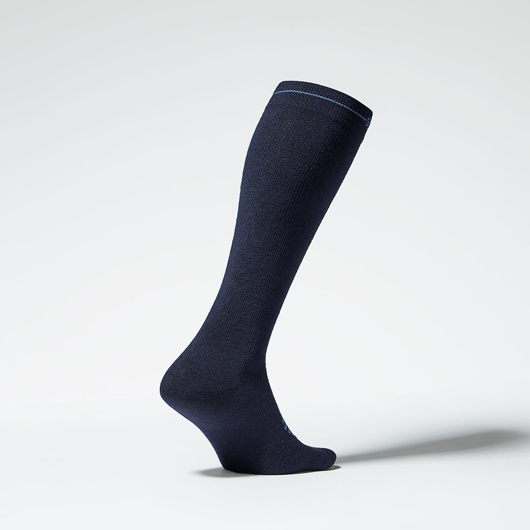 Side view of a blue knee high compression sock with blue details.