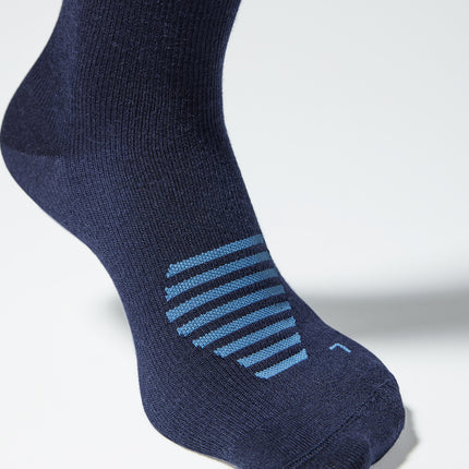 Detailed view of a blue knee high compression sock with blue details.