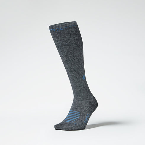 Front view of a grey knee high compression sock with blue details.