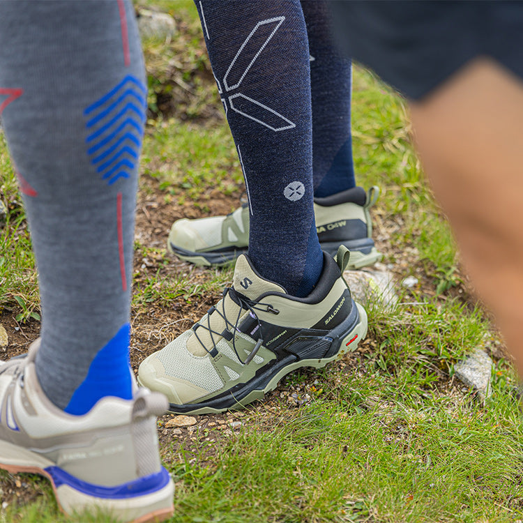 Feet in shoes with high socks.