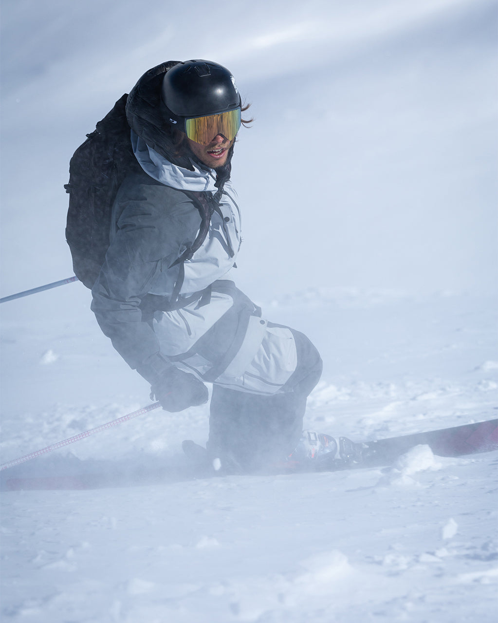 A skier on the slope in the mist.