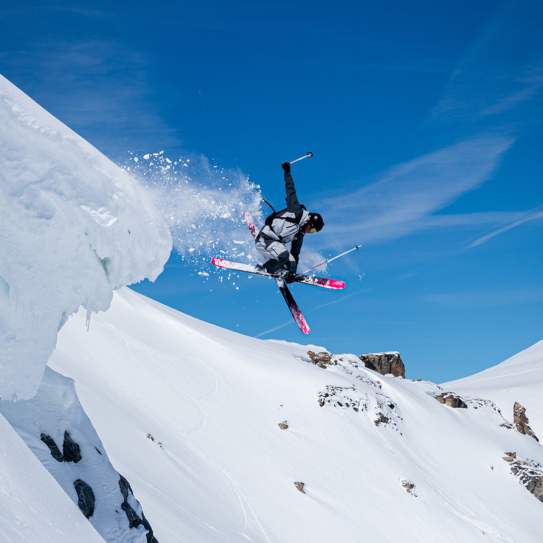 A skier is jumping off a slope.