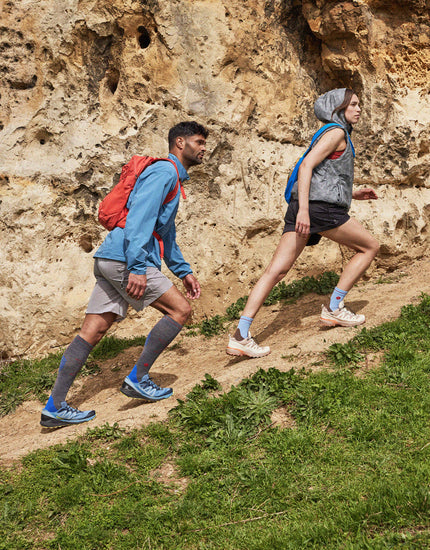 Couple walking up a hill.