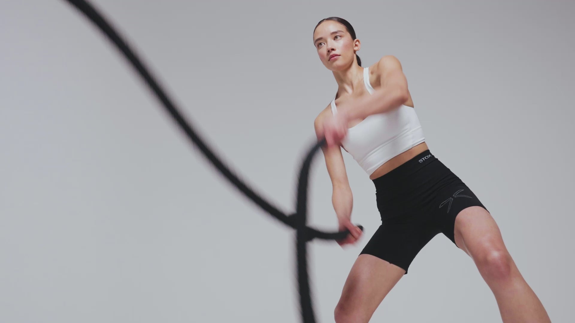 Women and men working out in a studio surrounding.